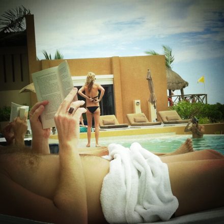 Pool side reading. Mobile photography