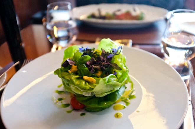 Butter Lettuce Salad, Avocado, Shropshire Blue Cheese, Champagne-Herb Vinaigrette topped with edible flowers at CUT London located inside the exquisite 45 Park Lane