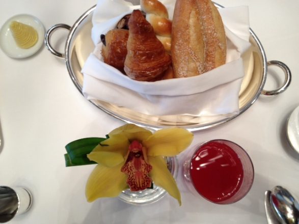 Orchid, juice, and fresh pastries. Amber (hyperlink) nails elegant breakfast